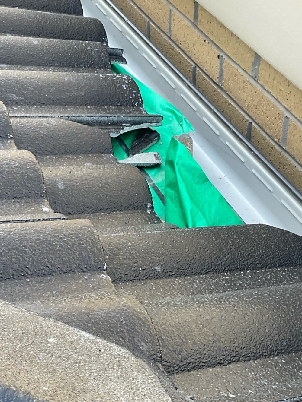 Broken and cracked roof tiles needing replacement, recorded during a fixing inspection in Point Cook